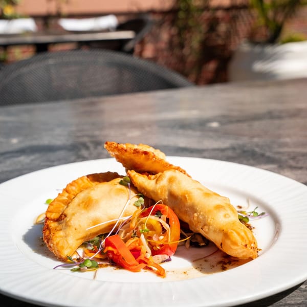 Fried empanadas with pepper salad