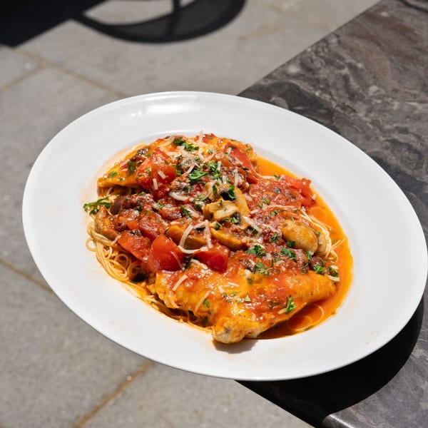Chicken over angel hair pasta in tomato sauce