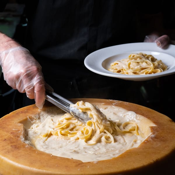 Fettuccine finished in a parmesan cheese wheel